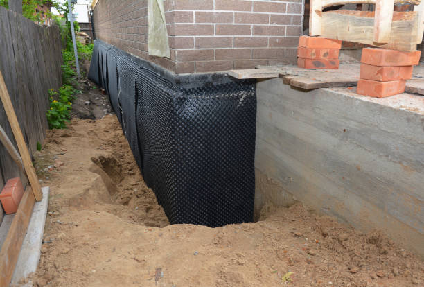 Happy homeowners after waterproofing job in Buckland